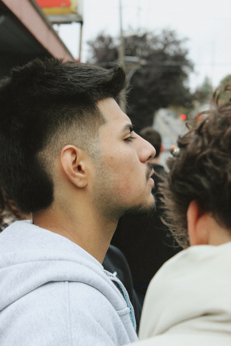 Man with stylish haircut looking to the side